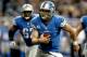DETROIT, MI - NOVEMBER 18: Quarterback Matthew Stafford #12 of the Detroit is chased out of the pocket against the Green Bay Packers at Ford Field on November 18, 2012 in Detroit, Michigan. (Photo by Matthew Stockman/Getty Images)