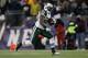 FOXBORO, MA - JANUARY 16: Runningback Shonn Greene #23 of the New York Jets runs with the ball against the New England Patriots during their 2011 AFC divisional playoff game at Gillette Stadium on January 16, 2011 in Foxboro, Massachusetts. (Photo by Elsa/Getty Images)