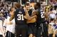 INDIANAPOLIS, IN - DECEMBER 15: Alex Barlow #3(center) of the Butler Bulldogs celebrates with Kameron Woods #31 and Khyle Marshall #23 after the game against the Indiana Hoosiers during Boston Scientific Close The Gap Crossroads Classic at Bankers Life Fieldhouse on December 15, 2012 in Indianapolis, Indiana. Butler won 88-86 in overtime. (Photo by Andy Lyons/Getty Images)