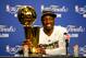 MIAMI, FL - JUNE 21: Dwyane Wade #3 of the Miami Heat smiles next to the Larry O'Brien Finals Championship trophy after they won 121-106 against the Oklahoma City Thunder in Game Five of the 2012 NBA Finals on June 21, 2012 at American Airlines Arena in Miami, Florida. NOTE TO USER: User expressly acknowledges and agrees that, by downloading and or using this photograph, User is consenting to the terms and conditions of the Getty Images License Agreement. (Photo by Ronald Martinez/Getty Images)