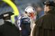 FOXBORO, MA - DECEMBER 16: Tom Brady #12 of the New England Patriots leaves the field by the Minuteman Militia after a loss to the San Francisco 49ers at Gillette Stadium on December 16, 2012 in Foxboro, Massachusetts. (Photo by Jim Rogash/Getty Images)