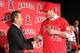 ANAHEIM, CA - DECEMBER 15: Owner Arte Moreno of the Los Angeles Angels of Anaheim and Josh Hamilton #32 of the Los Angeles Angels of Anaheim shake hands as Angels General Manager Jerry Dipoto (R) smiles in the background during the press conference to introduce Hamilton as the team's newest member at ESPN Zone at Downtown Disney on December 15, 2012 in Anaheim, California. (Photo by Victor Decolongon/Getty Images)