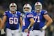 TORONTO, ON - DECEMBER 16: Ryan Fitzpatrick #14, Kraig Urbik #60 and Sam Young #71 of the Buffalo Bills watch a replay during a game against the Seattle Seahawks at Rogers Centre on December 16, 2012 in Toronto, Ontario, Canada.Seattle won 50-17. (Photo by Rick Stewart/Getty Images)