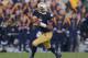 SOUTH BEND, IN - NOVEMBER 17: Everett Golson #5 of the Notre Dame Fighting Irish rolls out against the Wake Forest Demon Deacons at Notre Dame Stadium on November 17, 2012 in South Bend, Indiana. Notre Dame defeated Wake Forest 38-0. (Photo by Jonathan Daniel/Getty Images)