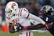 Oct 27 2012; Miami, FL, USA; Western Kentucky Hilltoppers running back Antonio Andrews (5) runs the ball past Florida International Golden Panthers cornerback Junior Mertile (2) in the first quarter at FIU Stadium. Mandatory Credit: Robert Mayer-USA TODAY Sports