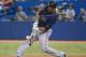 TORONTO, CANADA - AUGUST 31: Carlos Pena #23 of the Tampa Bay Rays hits a single in the ninth inning during MLB game action against the Toronto Blue Jays on August 31, 2012 at Rogers Centre in Toronto, Ontario, Canada. (Photo by Tom Szczerbowski/Getty Images)