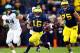 October 20, 2012; Ann Arbor, MI, USA; Michigan Wolverines quarterback Denard Robinson (16) runs the ball against the Michigan State Spartans during the 2nd half at Michigan Stadium. Michigan won 12-10. Mandatory Credit: Mike Carter-USA TODAY Sports
