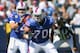 ORCHARD PARK, NY - SEPTEMBER 18: Eric Wood #70 of the Buffalo Bills snaps the ball to Ryan Fitzpatrick #14 against the Oakland Raiders at Ralph Wilson Stadium on September 18, 2011 in Orchard Park, New York. Buffalo won 38-35. (Photo by Rick Stewart/Getty Images)