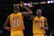 LOS ANGELES, CA - DECEMBER 18: Jodie Meeks #20 and Kobe Bryant #24 of the Los Angeles Lakers celebrate their teams 101-100 victory over the Charlotte Bobcats at Staples Center on December 18, 2012 in Los Angeles, California. NOTE TO USER: User expressly acknowledges and agrees that, by downloading and or using this photograph, User is consenting to the terms and conditions of the Getty Images License Agreement. (Photo by Jeff Gross/Getty Images)
