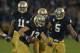 SOUTH BEND, IN - OCTOBER 20: Danny Spond #13 of the Notre Dame Fighting Irish celebrates with teammates including Ishaq Williams #11 and Manti T'eo #5 after intercepting a pass on the next to last play of the game against the BYU Cougars at Notre Dame Stadium on October 20, 2012 in South Bend, Indiana. Notre Dame defeated BYU 17-14. (Photo by Jonathan Daniel/Getty Images)
