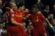 LIVERPOOL, ENGLAND - NOVEMBER 17: Luis Suarez (C) of Liverpool is congratulated by team-mates Raheem Sterling (R) and Jose Enrique after scoring the opening goal during the Barclays Premier League match between Liverpool and Wigan Athletic at Anfield on November 17, 2012 in Liverpool, England. (Photo by Chris Brunskill/Getty Images)
