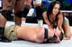 AJ Lee kneels over a fallen John Cena. (Courtesy of WWE.com)