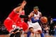 Apr. 8, 2012; New York, NY, USA; New York Knicks small forward Carmelo Anthony (7) drives the ball around Chicago Bulls small forward Luol Deng (9) and power forward Carlos Boozer (5) during the second half at Madison Square Garden. Knicks won in overtime 100-99. Mandatory Credit: Debby Wong-USA TODAY Sports