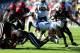 SAN DIEGO - OCTOBER 17: Harvey Unga #45 of BYU Cougars gets tackled by Brandon Kohn #11 of San Diego State Aztecs at Qualcomm Stadium on October 17, 2009 in San Diego, California. (Photo by Jacob de Golish/Getty Images)