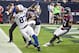 HOUSTON, TX - DECEMBER 16: Reggie Wayne #87 of the Indianapolis Colts completes a pass in the endzone as he beats Danieal Manning #38 and Quintin Demps #27 of the Houston Texans on the play in the first half at Reliant Stadium on December 16, 2012 in Houston, Texas. The play was negated by a penalty. (Photo by Bob Levey/Getty Images)