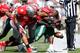 COLUMBUS, OH - SEPTEMBER 22: Jackie Williams #15 of the University of Alabama at Birmingham Blazers is gang tackled by the Ohio State Buckeyes defense during the second quarter on September 22, 2012 at Ohio Stadium in Columbus, Ohio. (Photo by Kirk Irwin/Getty Images)
