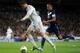 MADRID, SPAIN - MARCH 18: Cristiano Ronaldo (L) of Real Madrid duels for the ball with Weligton Pena de Oliveira of Malaga during the la Liga match between Real Madrid CF and Malaga CF at the Estadio Santiago Bernabeu on March 18, 2012 in Madrid, Spain. (Photo by Jasper Juinen/Getty Images)