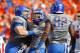 BOISE, ID - OCTOBER 13: Michael Atkinson #99 and Demarcus Lawrence #8 of the Boise State Broncos celebrate after a play against the Fresno State Bulldogs at Bronco Stadium on October 13, 2012 in Boise, Idaho. (Photo by Otto Kitsinger III/Getty Images)
