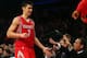 NEW YORK, NY - DECEMBER 17: Jeremy Lin #7 of the Houston Rockets is congratulated in the fourth quarter after he is pulled from the game against the New York Knicks on December 17, 2012 at Madison Square Garden in New York City. The Houston Rockets defeated the New York Knicks 109-96. NOTE TO USER: User expressly acknowledges and agrees that, by downloading and/or using this photograph, user is consenting to the terms and conditions of the Getty Images License Agreement. (Photo by Elsa/Getty Images)