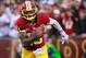 December 9, 2012; Landover, MD, USA; Washington Redskins quarterback Robert Griffin III (10) runs with the ball against the Baltimore Ravens at FedEx Field. Mandatory Credit: Geoff Burke-USA TODAY Sports