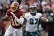 WASHINGTON, DC - NOVEMBER 18: Quarterback Robert Griffin III #10 of the Washington Redskins eludes the tackle Cullen Jenkins #97 of the Philadelphia Eagles at FedEx Field on November 18, 2012 in Washington, DC. (Photo by Rob Carr/Getty Images)