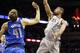 Dec 23, 2012; San Antonio, TX, USA; San Antonio Spurs forward Tim Duncan (21) takes a shot over Dallas Mavericks forward Dirk Nowitzki (41) during the first half at the AT&T Center. Mandatory Credit: Soobum Im-USA TODAY Sports
