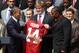WASHINGTON, DC - APRIL 19: U.S. President Barack Obama (L) shakes hands with defensive lineman Damion Square (R) as offensive lineman Barrett Jones (2nd R) of the Alabama Crimson Tide looks on after Obama was presented with a jersey of the University of Alabama Crimson Tide during a South Lawn event at the White House April 19, 2012 in Washington, DC. Obama hosted the BCS national champion to honor their win over the Louisiana State University Tigers. (Photo by Alex Wong/Getty Images)