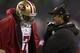 SEATTLE, WA - DECEMBER 23: San Francisco 49ers head coach John Harbaugh talks with Colin Kaepernick #7 on the sideline of a game against the Seattle Seahawks at CenturyLink Field on December 23, 2012 in Seattle, Washington. (Photo by Stephen Brashear/Getty Images)