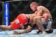 August 4, 2012; Los Angeles, CA, USA; Joe Lauzon brings down Jamie Varner during the lightweight match at Staples Center. Mandatory Credit: Gary A. Vasquez-USA TODAY Sports