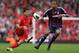 LIVERPOOL, ENGLAND - OCTOBER 07: Steven N' Zonzi of Stoke City competes with Luis Suarez of Liverpool during the Barclays Premier League match between Liverpool and Stoke City at Anfield on October 7, 2012 in Liverpool, England. (Photo by Clive Brunskill/Getty Images)