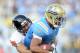 PASADENA, CA - NOVEMBER 06: Anthony Barr #2 of the UCLA Bruins attempts to break free from Suaesi Tuimaunei #28 of the Oregon State Beavers at the Rose Bowl on November 6, 2010 in Pasadena, California. (Photo by Harry How/Getty Images)