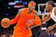 December 25, 2012; Los Angeles, CA, USA; New York Knicks small forward Carmelo Anthony (7) moves the ball against the defense of Los Angeles Lakers small forward Metta World Peace (15) during the first half at Staples Center. Mandatory Credit: Gary A. Vasquez-USA TODAY Sports