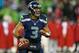 SEATTLE, WA - DECEMBER 23: Quarterback Russell Wilson #3 of the Seattle Seahawks looks downfield to pass against the San Francisco 49ers at CenturyLink Field on December 23, 2012 in Seattle, Washington. (Photo by Otto Greule Jr/Getty Images)