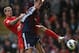 LIVERPOOL, ENGLAND - OCTOBER 07: Peter Crouch of Stoke City competes with Daniel Agger of Liverpool during the Barclays Premier League match between Liverpool and Stoke City at Anfield on October 7, 2012 in Liverpool, England. (Photo by Clive Brunskill/Getty Images)