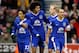 STOKE-ON-TRENT, ENGLAND - DECEMBER 15: Manager David Moyes (L) of Everton speaks to his player Steven Pienaar (C) as he celebrates his goal with Everton team mates during the Barclays Premier League match between Stoke City and Everton at the Britannia Stadium on December 15, 2012, in Stoke-on-Trent, England. (Photo by Paul Thomas/Getty Images)