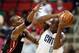 Oct 23, 2012; Raleigh, NC, USA; Miami Heat power forward Chris Bosh (1) defends against Charlotte Bobcats power forward Bismack Biyombo (0) in the first half at PNC Arena. Mandatory Credit: Mark Dolejs-USA TODAY Sports