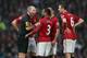 MANCHESTER, ENGLAND - DECEMBER 26: Patrice Evra of Manchester United argues with referee Mike Dean after he allows the own goal of Jonny Evans stand during the Barclays Premier League match between Manchester United and Newcastle United at Old Trafford December 26, 2012 in Manchester, England. (Photo by Clive Brunskill/Getty Images)