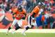 DENVER, CO - DECEMBER 23: Running back Knowshon Moreno #27 of the Denver Broncos rushes after taking a hand off from quarterback Peyton Manning #18 during a game against the Cleveland Browns at Sports Authority Field at Mile High on December 23, 2012 in Denver, Colorado. The Broncos defeated the Browns 34-12. (Photo by Dustin Bradford/Getty Images)