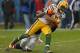 CHICAGO, IL - DECEMBER 16: Randall Cobb #18 of the Green Bay Packers is tackled by D.J. Moore #30 of the Chicago Bears after catching a pass for a first down at Soldier Field on December 16, 2012 in Chicago, Illinois. The Packers defeated the Bears 21-13. (Photo by Jonathan Daniel/Getty Images)