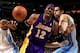 DENVER, CO - DECEMBER 26: Dwight Howard #12 of the Los Angeles Lakers looses control of the ball against the defense of Kosta Koufos #41 of the Denver Nuggets at Pepsi Center on December 26, 2012 in Denver, Colorado. NOTE TO USER: User expressly acknowledges and agrees that, by downloading and or using this photograph, User is consenting to the terms and conditions of the Getty Images License Agreement. (Photo by Doug Pensinger/Getty Images)