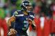 SEATTLE, WA - DECEMBER 23: Quarterback Russell Wilson #3 of the Seattle Seahawks looks downfield to pass against the San Francisco 49ers at CenturyLink Field on December 23, 2012 in Seattle, Washington. (Photo by Otto Greule Jr/Getty Images)