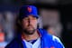 NEW YORK, NY - APRIL 07: R.A. Dickey #43 of the New York Mets looks on from the dugout against the Atlanta Braves at Citi Field on April 7, 2012 in the Flushing neighborhood of the Queens borough of New York City. (Photo by Chris Trotman/Getty Images)