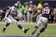 HOUSTON, TX - DECEMBER 23: Adrian Peterson #28 of the Minnesota Vikings looks to avoid a tackled by Glover Quin #29 of the Houston Texans at Reliant Stadium on December 23, 2012 in Houston, Texas. (Photo by Bob Levey/Getty Images)