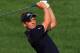 DUBAI, UNITED ARAB EMIRATES - NOVEMBER 25: Luke Donald of England plays his second shot at the par 5, 14th hole during the final round of the 2012 DP World Tour Championship on the Earth Course at Jumeirah Golf Estates on November 25, 2012 in Dubai, United Arab Emirates. (Photo by David Cannon/Getty Images)