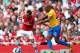 LONDON, ENGLAND - SEPTEMBER 15: Santi Cazorla of Arsenal and Jason Puncheon of Southhampton fight for the ball during the Barclays Premier League match between Arsenal and Southampton at Emirates Stadium on September 15, 2012 in London, England. (Photo by Clive Mason/Getty Images)