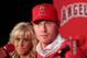 ANAHEIM, CA - DECEMBER 15: Josh Hamilton #32 of the Los Angeles Angels of Anaheim listens to a question from the media as wife Katie looks on during the press conference introducing Hamilton as the team's newest member at ESPN Zone at Downtown Disney on December 15, 2012 in Anaheim, California. (Photo by Victor Decolongon/Getty Images)