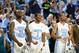 Dec 22, 2012; Chapel Hill, NC, USA; North Carolina Tar Heels players P.J. Hairston (15) and Dexter Strickland (1) and J.P. Tokoto (25) react on the bench at the end of the game. The Tar Heels defeated McNeese State 97-63 at the Dean E Smith Center. Mandatory Credit: Bob Donnan-USA TODAY Sports