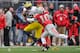 COLUMBUS, OH - NOVEMBER 24: Quarterback Devin Gardner #12 of the Michigan Wolverines tries to elude the tackle attempt of Ryan Shazier #10 of the Ohio State Buckeyes at Ohio Stadium on November 24, 2012 in Columbus, Ohio. (Photo by Jamie Sabau/Getty Images)