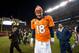 DENVER, CO - DECEMBER 23: Quarterback Peyton Manning #18 of the Denver Broncos walks out to shake hands with members of the Cleveland Browns after a game at Sports Authority Field at Mile High on December 23, 2012 in Denver, Colorado. The Broncos defeated the Browns 34-12. (Photo by Dustin Bradford/Getty Images)