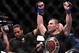 Dec 29, 2012; Las Vegas, NV, USA; Cain Velasquez (right) regains the UFC Heavyweight Championship from Junior Dos Santos (left) during UFC 155 at the MGM Grand Garden Arena. Mandatory Credit: Gary A. Vasquez-USA TODAY Sports